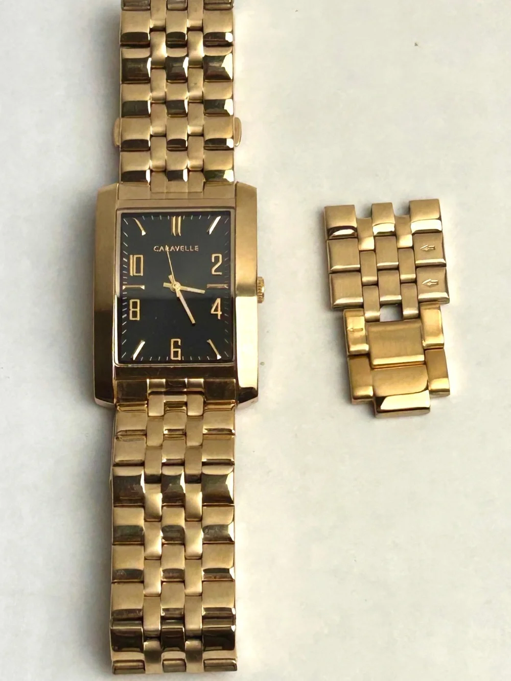 Caravelle by Bulova Men’s Gold Tone Rectangular Bracelet Watch Black dial 44A110